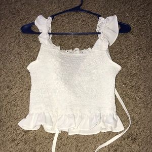 Cute white tank and ties in the back